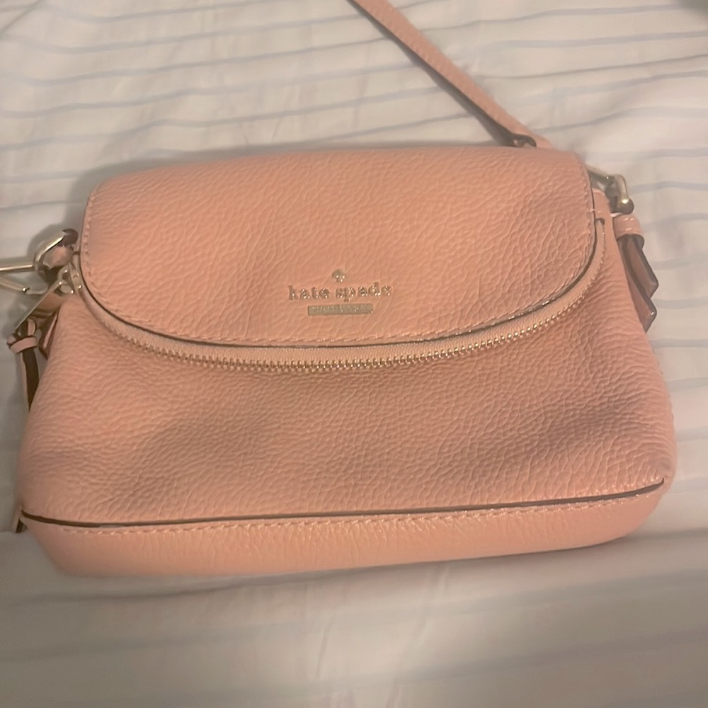 Blush pink colors Kate Spade purse.